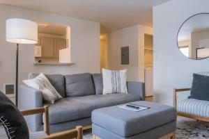 a living room with a couch and a table at Modern Lofts at Aria 1 in Kalispell