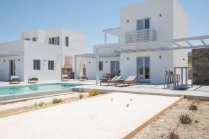 a villa with a swimming pool and a house at Beautiful Paros Villa - 1 Bedroom - Villa Rock - Private Jacuzzi and Garden View - Naousa in Livadia