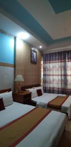 Giường trong phòng chung tại Homstay Thanh Sơn