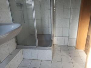 a bathroom with a shower and a sink at Monteurzimmer - Waldbronn in Waldbronn