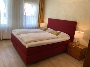 Una cama o camas en una habitación de Ferienwohnung Janus Altstadt-Hameln Haus 1 inklusive Parkplatz mit und ohne Balkon