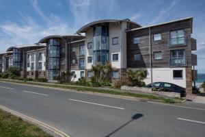 an apartment building on the side of the road at Bathsheba, Ocean 1 in Newquay