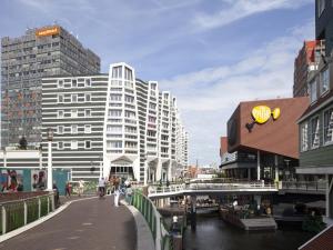 a view of a city with buildings and a bridge at easyHotel Amsterdam Zaandam in Zaandam