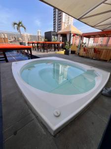 a jacuzzi tub on the roof of a building at Hotel La Serrania Bucaramanga in Bucaramanga