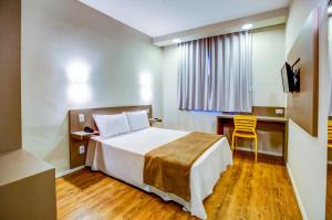 Giường trong phòng chung tại Blue Tree Towers Sorriso