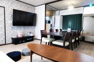 a dining room with a table and chairs at Villa Hikone Castle in Hikone