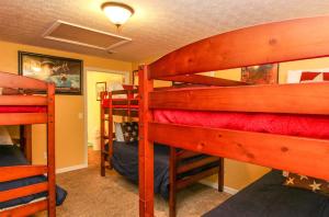a bedroom with two bunk beds in a room at House #14 Pelican Sunrise (no pets) Lake View in Centre