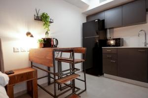 a small kitchen with a counter and a sink at Sea side 87 Sweet Me Eilat אילת in Eilat