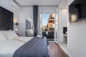 Antares Luxury Rooms 2客房内的一张或多张床位