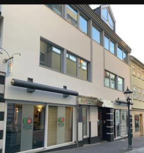 a building with a street light in front of it at Lifestyle Apartments - CityLoft in Coburg