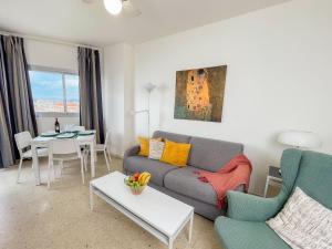 a living room with a couch and a table at Club Maritimo at Ronda III in Fuengirola