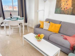 a living room with a couch and a table at Club Maritimo at Ronda III in Fuengirola