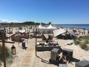 a beach with a bunch of people on the sand at Ostseeliebe M-5-6 in Heiligenhafen