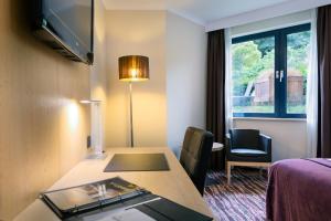 Sjónvarps- og/eða afþreyingartæki á Hotel Restaurant Van Der Valk Nivelles-Sud