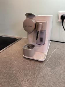 a coffee maker sitting on top of a counter at Apartments Palmovka in Prague