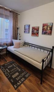a large bed in a room with at City Pension Zwickau in Zwickau