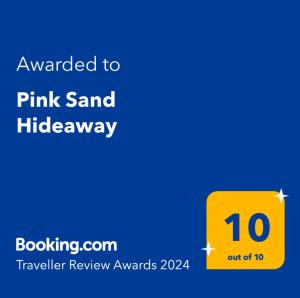 Ett certifikat, pris eller annat dokument som visas upp på Pink Sand Hideaway