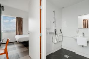 a bathroom with a toilet and a sink at easyHotel Amsterdam Zaandam in Zaandam