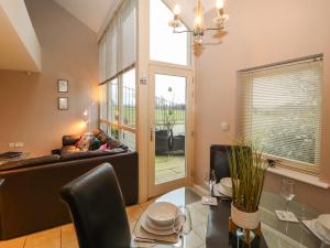 a living room with a couch and a table at Lark Meadow in Carnforth