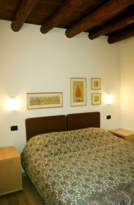 Postel nebo postele na pokoji v ubytování Agriturismo Nicobresaola