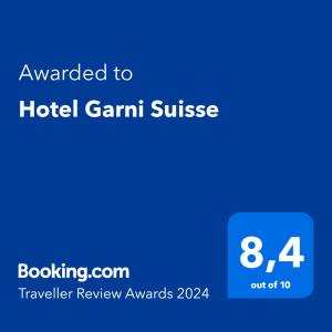 a blue sign that reads awarded to hotel grant suite at Hotel Garni Suisse in San Martino di Castrozza