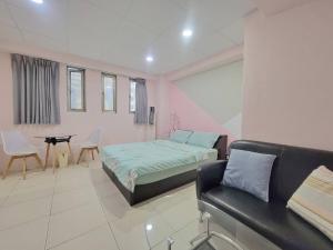 A bed or beds in a room at Good Fit Homestay