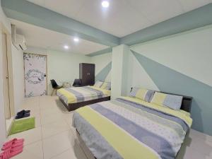 A bed or beds in a room at Good Fit Homestay
