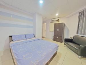 A bed or beds in a room at Good Fit Homestay