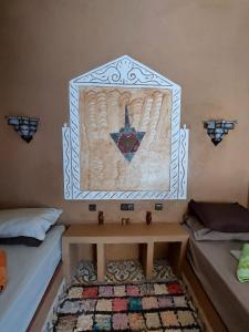 Postel nebo postele na pokoji v ubytování Hotel Riad Sahara Activity