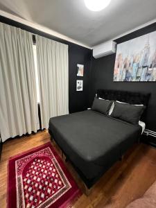 Un pat sau paturi într-o cameră la Hotel Bellavista Santiago Suite