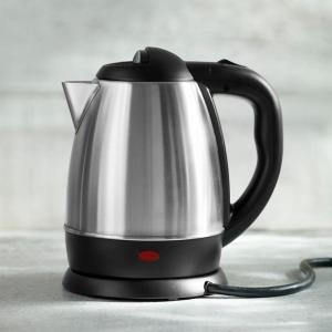 a black and silver tea kettle sitting on a counter at 23 HOTEL & RESIDENCE in Yangon