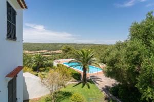 an image of a villa with a swimming pool and trees at La vista del angel in Son Bou