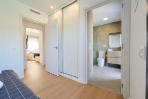 a room with a bathroom with a toilet and a sink at 2Agnes01 in Vidreres +18 photos