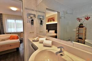 Kúpeľňa v ubytovaní Flairhotel am Wörthersee