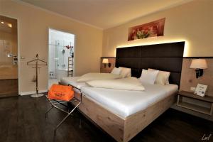 Posteľ alebo postele v izbe v ubytovaní Flairhotel am Wörthersee