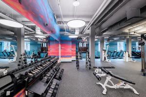 a gym with lots of treadmills and exercise equipment at Brighton 2br w gym nr green line dining BOS-982 in Boston