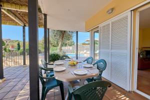 a table and chairs on the patio of a house at Villa Franci - Blanes in Blanes
