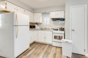 a kitchen with white cabinets and a white refrigerator at Convenient Newark Home about 2 Mi to Downtown! in Newark