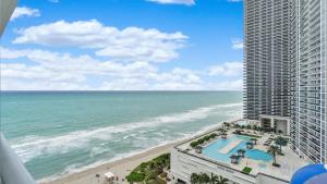 a view of the ocean from the balcony of a building at 2 bed rental on the beach15th floor Hollywood Miami in Hallandale Beach