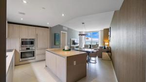 a kitchen with a island and a counter in a room at 2 bed rental on the beach15th floor Hollywood Miami in Hallandale Beach