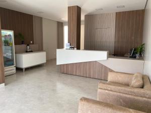 a living room with a counter and a couch at Hotel Colorado in Vilhena