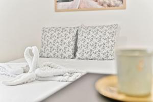 a table with towels and a candle and a glass of milk at Appartement proche Canal Saint Martin in Paris