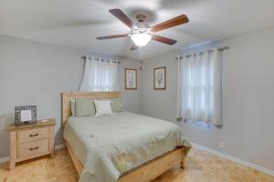 a bedroom with a bed with a ceiling fan at Celina Home about 1 Mi to Marina Boat, Fish and More! in Celina