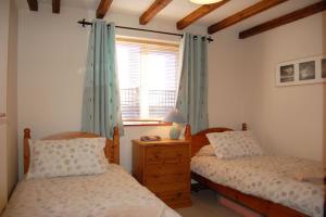 Tempat tidur dalam kamar di Glyn Saron near Tywyn