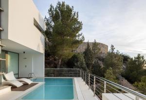 a swimming pool on the balcony of a house at Buccara Altea Hills Villas in Altea