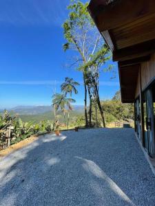 a driveway to a house with a view of a mountain at Recanto Nascer do Sol in Aguas Mornas +16 photos