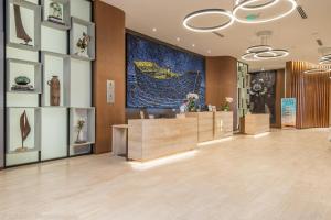 a lobby of a store with a large painting on the wall at Ocean View Balcony with Pool Gym Access in Hallandale Beach +19 photos