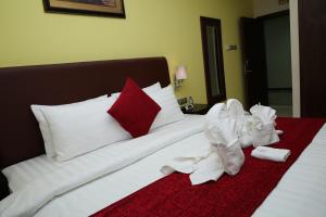 Voodi või voodid majutusasutuse Mirage Hotel Al Aqah toas
