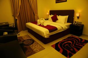 Voodi või voodid majutusasutuse Mirage Hotel Al Aqah toas