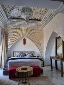 Ένα ή περισσότερα κρεβάτια σε δωμάτιο στο Riad l'Animation